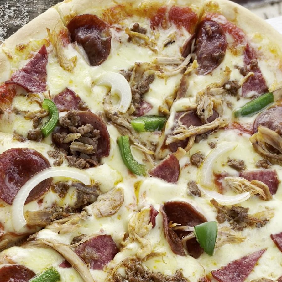 Homemade pizza fresh from the kitchen at Lani's Resto, a restaurant in Tanjung Setia near Krui